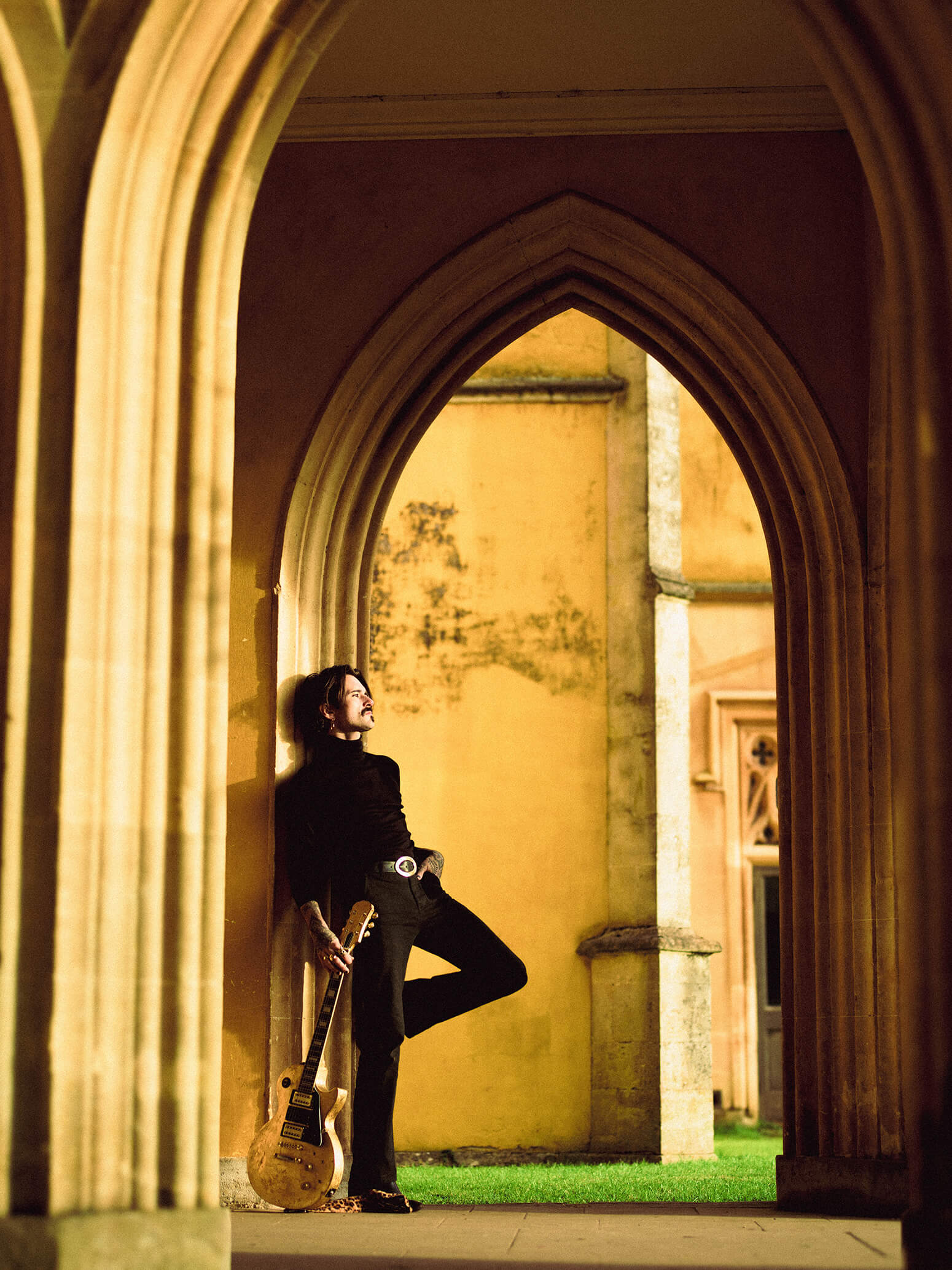 An Image of Stanley Duke standing in an Archway